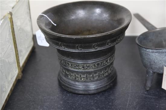 A Flemish bronze mortar, by Jan van den Ghein II, Malines, dated 1559, height 8in.